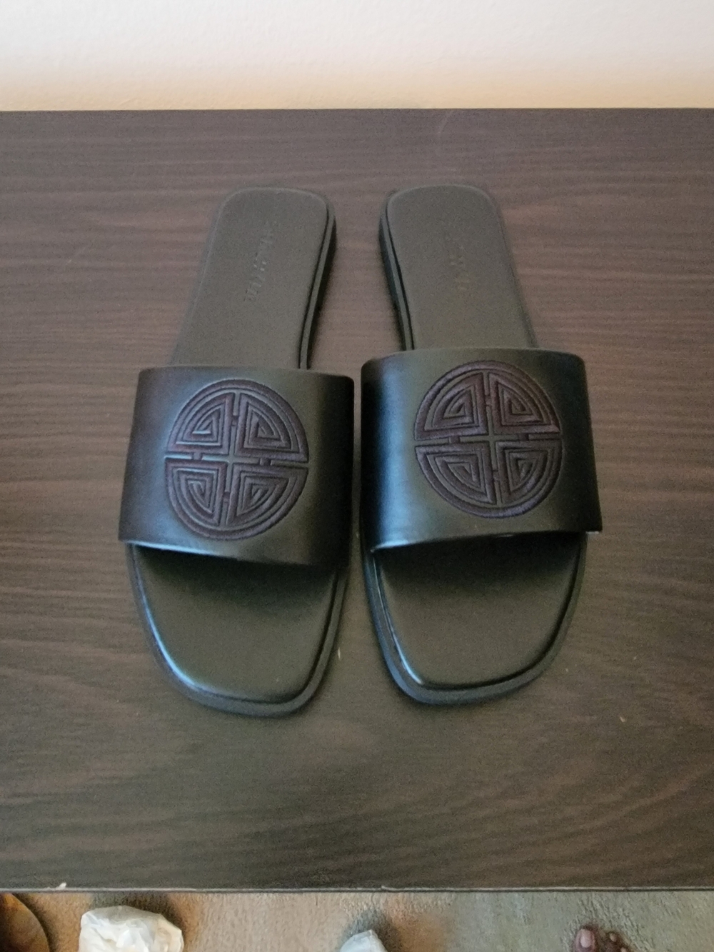 Women's Black Slide Sandals with Embossed Medallion